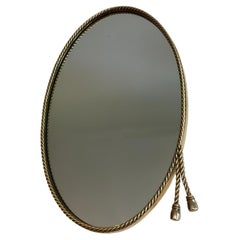 Miroir ovale en laiton entouré d'une Corde Dans le style de la Maison Bagués.