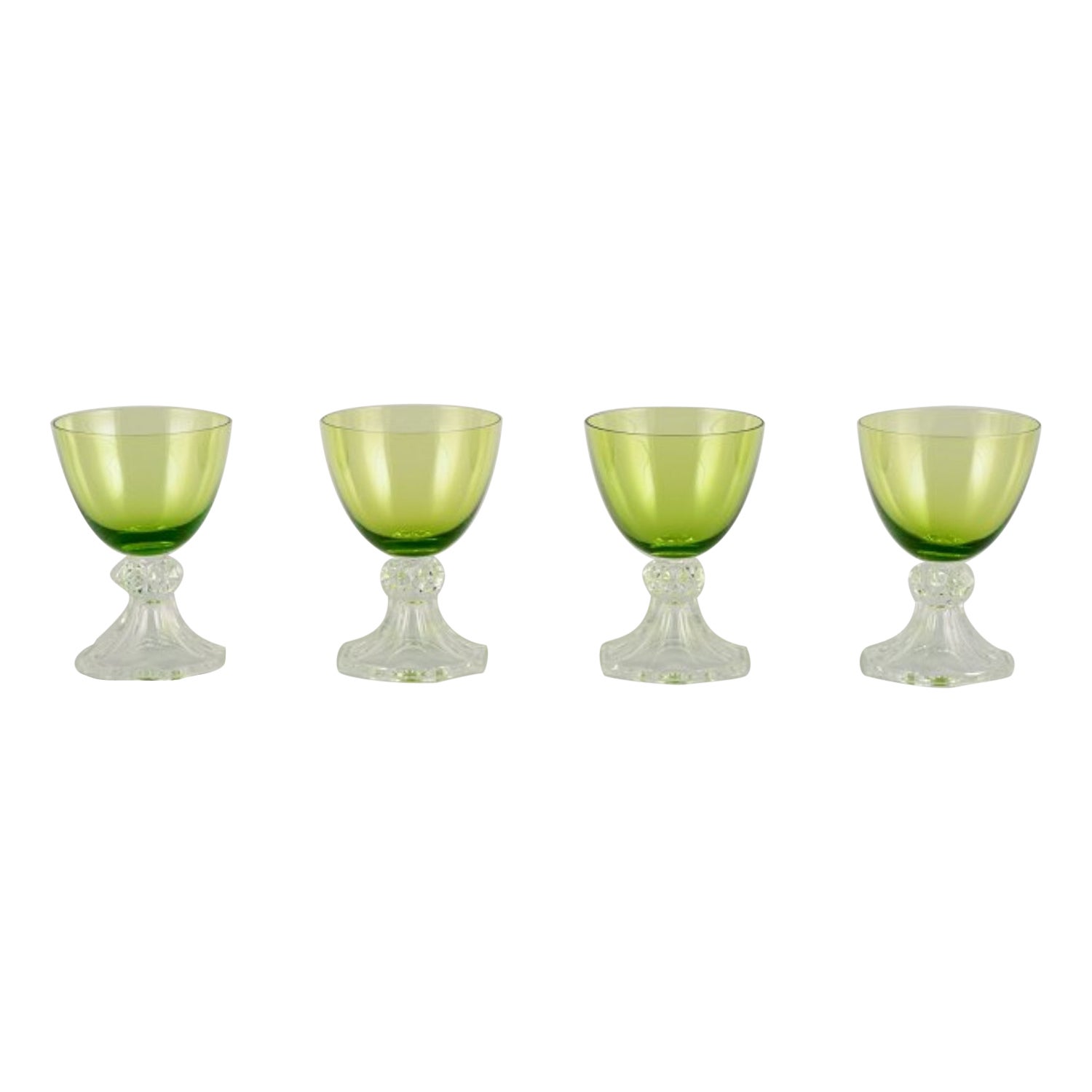 Val St. Lambert. Set of four white wine glasses in green and clear glass.