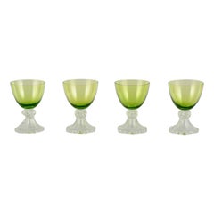 Vintage Val St. Lambert. Set of four white wine glasses in green and clear glass.