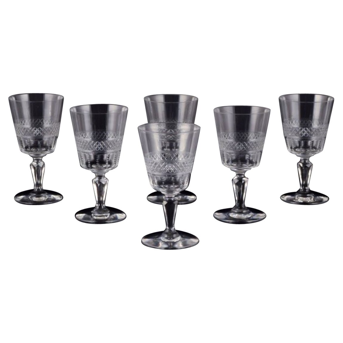 Set of six mouth-blown French white wine glasses in crystal glass.