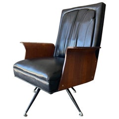 1960s swivel and rocking lounge chair by Murphy-Miller with sculptural wood arms