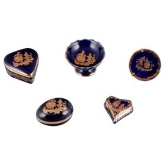 Limoges, France. Five pieces of miniature porcelain decorated with gold leaf.