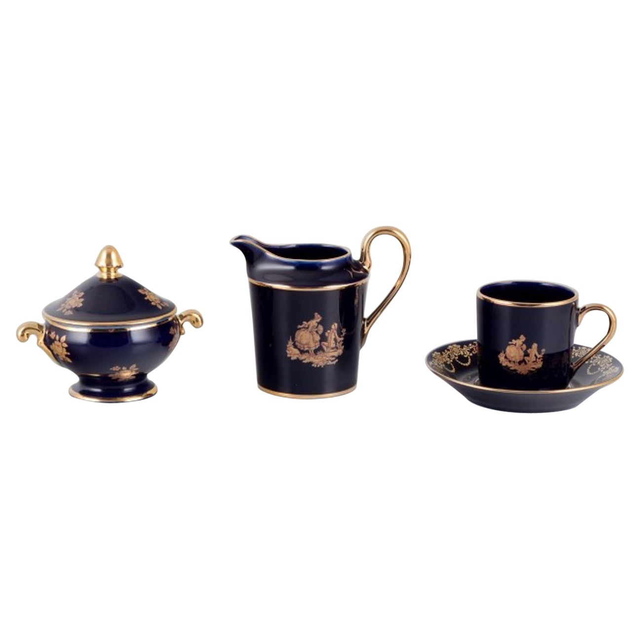 Limoges, Francia. Taza de café, azucarero y cremera de porcelana.