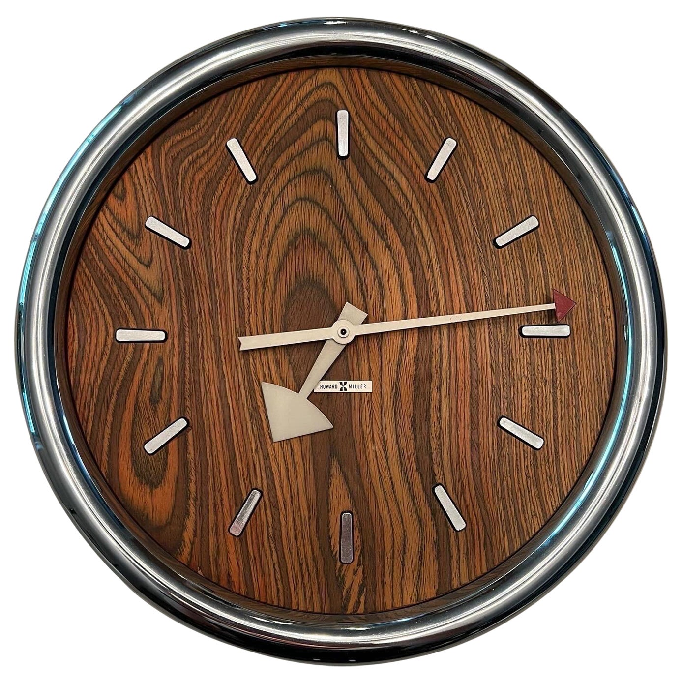 1970s Howard Miller zebrawood and chrome wall clock designed by Arthur Umanoff