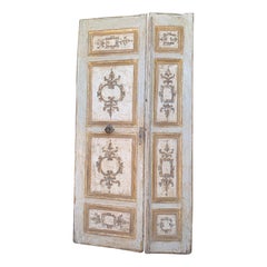 Antique Door in lacquered and richly painted wood, gilded in the details, Florence
