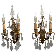 Pair of bronze wall lamps with crystal hangings