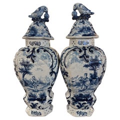 Pair of 19th Century French Blue and White Faience Delft Vases with Parrot Lids