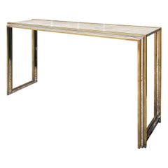 An Italian Travertine Topped Brass And Chrome Console Table