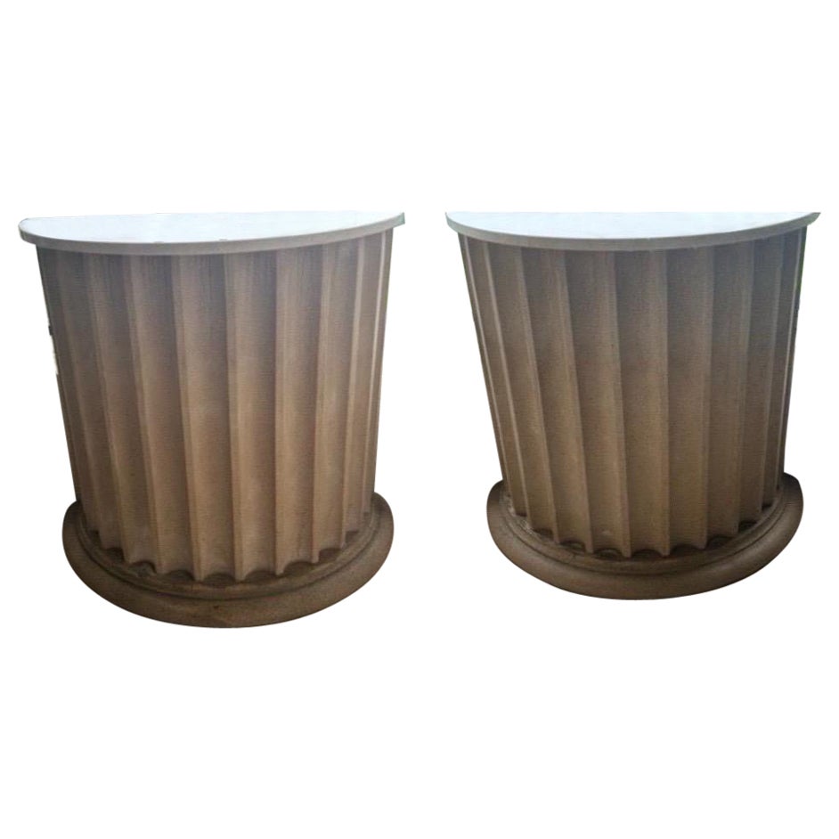 Pair of garden tables with marble tops on fluted demilune cast sandstone bases