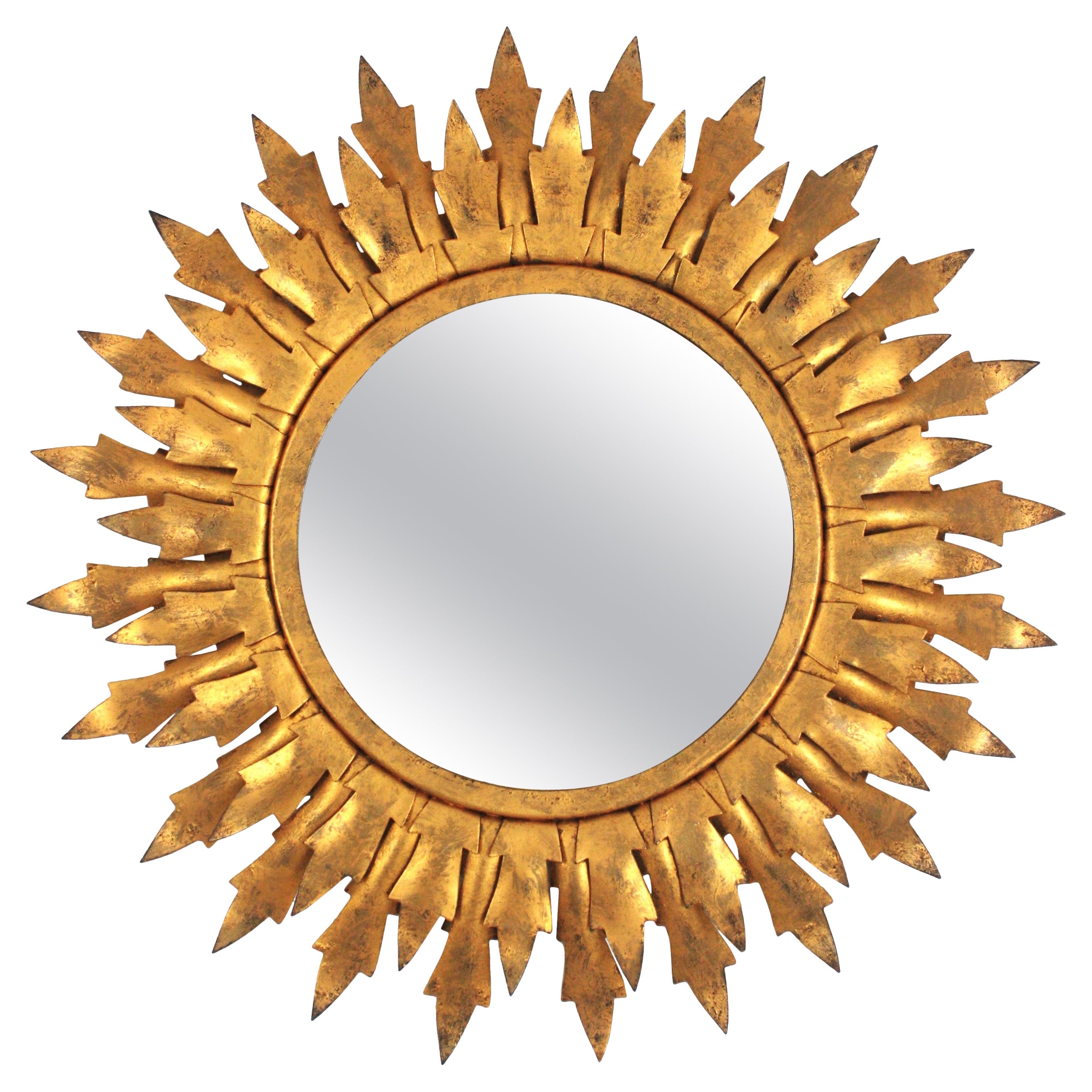 Espejo Sunburst en metal dorado con marco de doble hoja, años 50