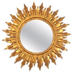 Espejo Sunburst en metal dorado con marco de doble hoja, años 50