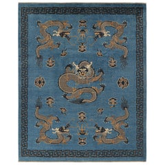 Rug & Kilim’s Pictorial Dragon Rug in Navy Blue, with Geometric Borders