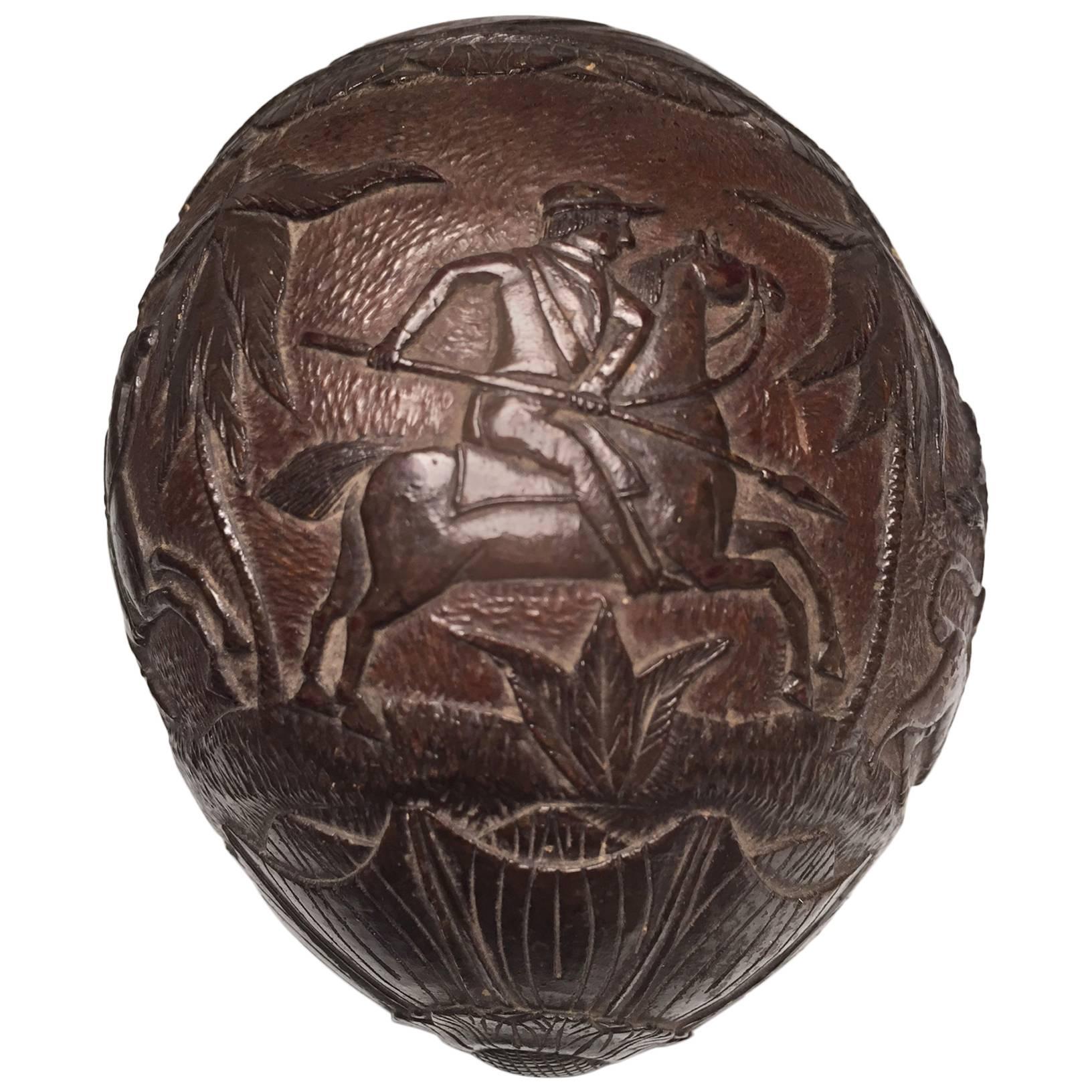19th Century "Bugbear" Carved Coconut with a Lion and Equestrian Hunt Scene