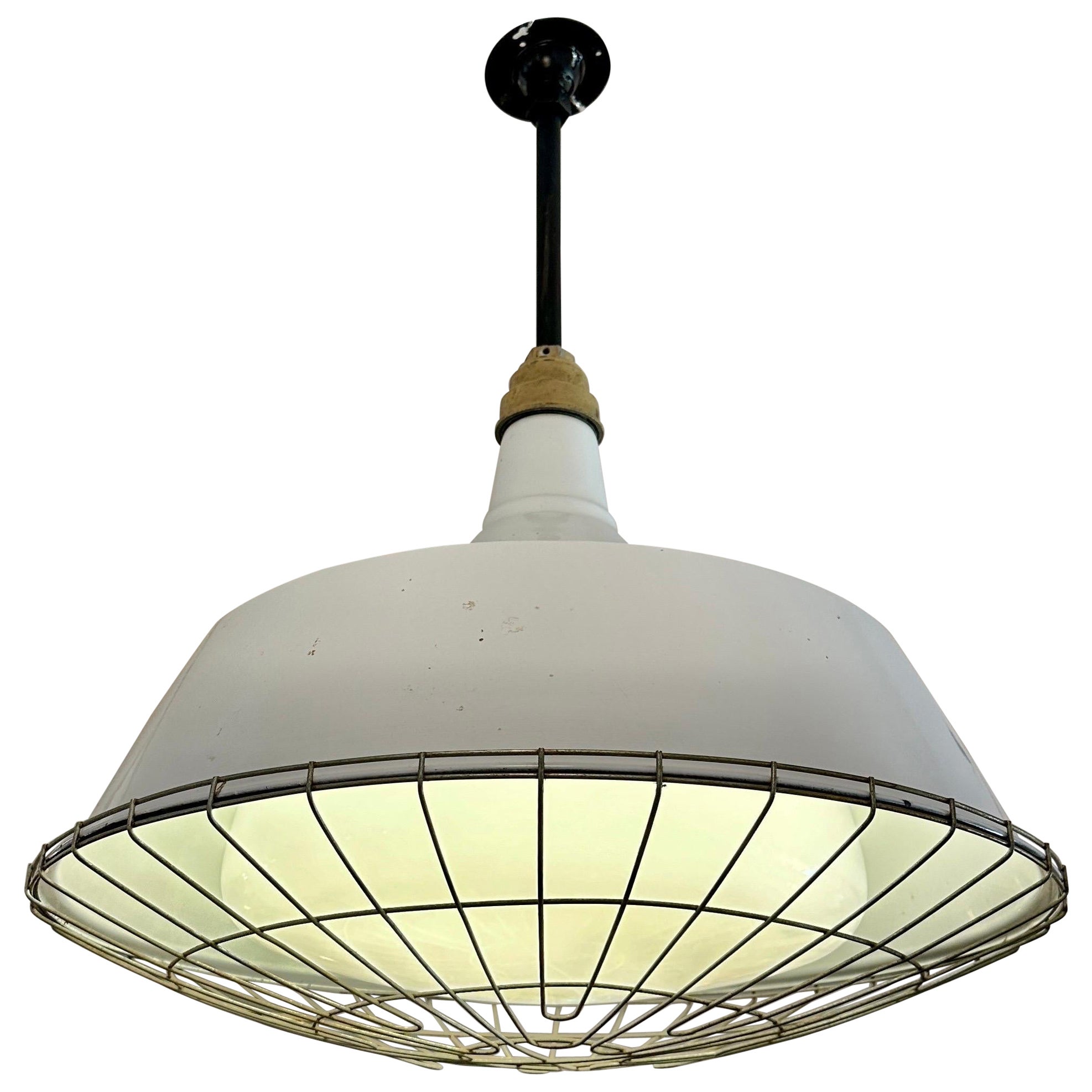 Industrial Pendant w/ Metal Cage Over Enamel and Milk Glass For Sale