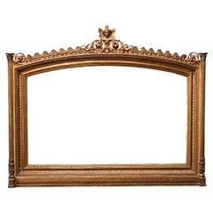 Antique miroir de cheminée Empire français figuratif en bois doré avec masque