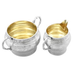 Jarra para crema y azucarero victorianos antiguos de plata de ley (1884)