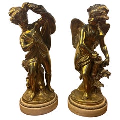 A pair of French gilt bronze figures signed Etienne Maurice Falconett
