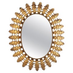 Spanish Foliage Oval Sunburst Mirror in Gilt Iron, 1950s