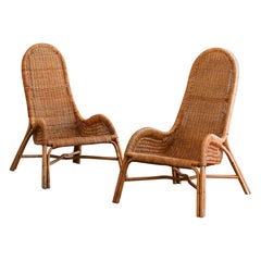 Pair of wicker armchairs with curved backrests, 1980s.