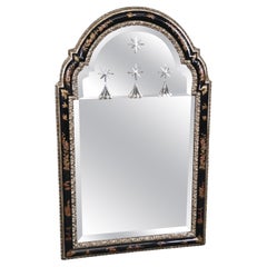 Miroir en verre gravé, laqué noir et ébonité, de style Maison Jansen