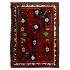 Alfombra vintage kazaka de lana hecha a mano en rojo con diseño geométrico