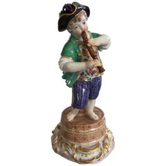 Meissen Figurine of Boy with Flute and Wine Barrel