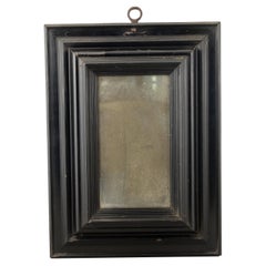 Antique Frame with mirror. Ebonized wood, glass. 17th century.