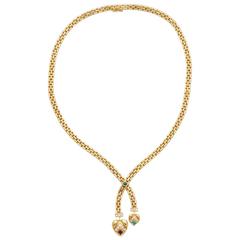 Halskette aus Gold und Edelsteinen im Retro-Stil von Cartier