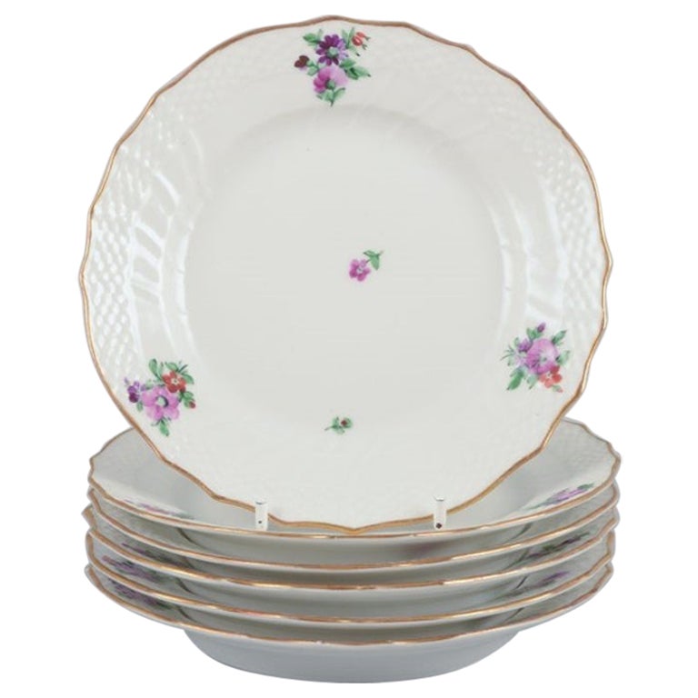 Flor Sajona de Royal Copenhagen. Seis platos de porcelana con motivos florales.