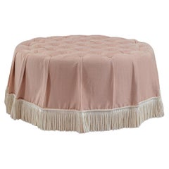 The Amelia Ottoman, in deep buttoned pink linen, ticking stripe & bullion fringe