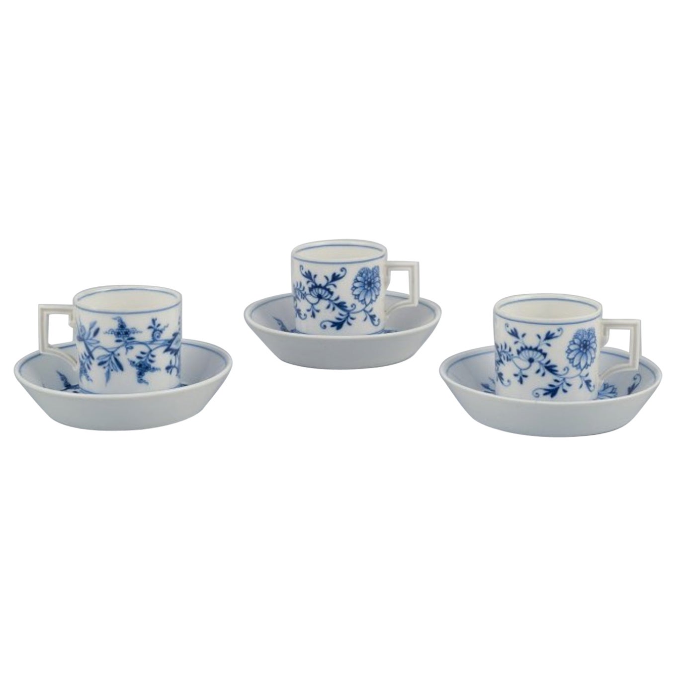 Meissen, Germany. Blue Onion. Set of three small chocolate cups with saucers.