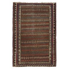 Alfombra persa antigua en marrón con motivos geométricos de colores, de Rug & Kilim