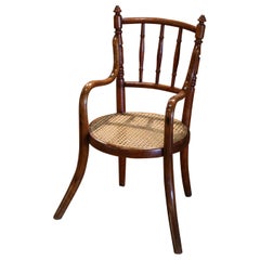 Poltrona Child & Child in legno di bengala e canna dei primi del Novecento francese, stile Thonet