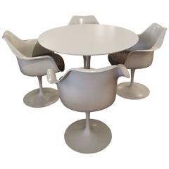 Set of Four Knoll Saarinen Swivel Tulip Armchairs and Laminate Round Table