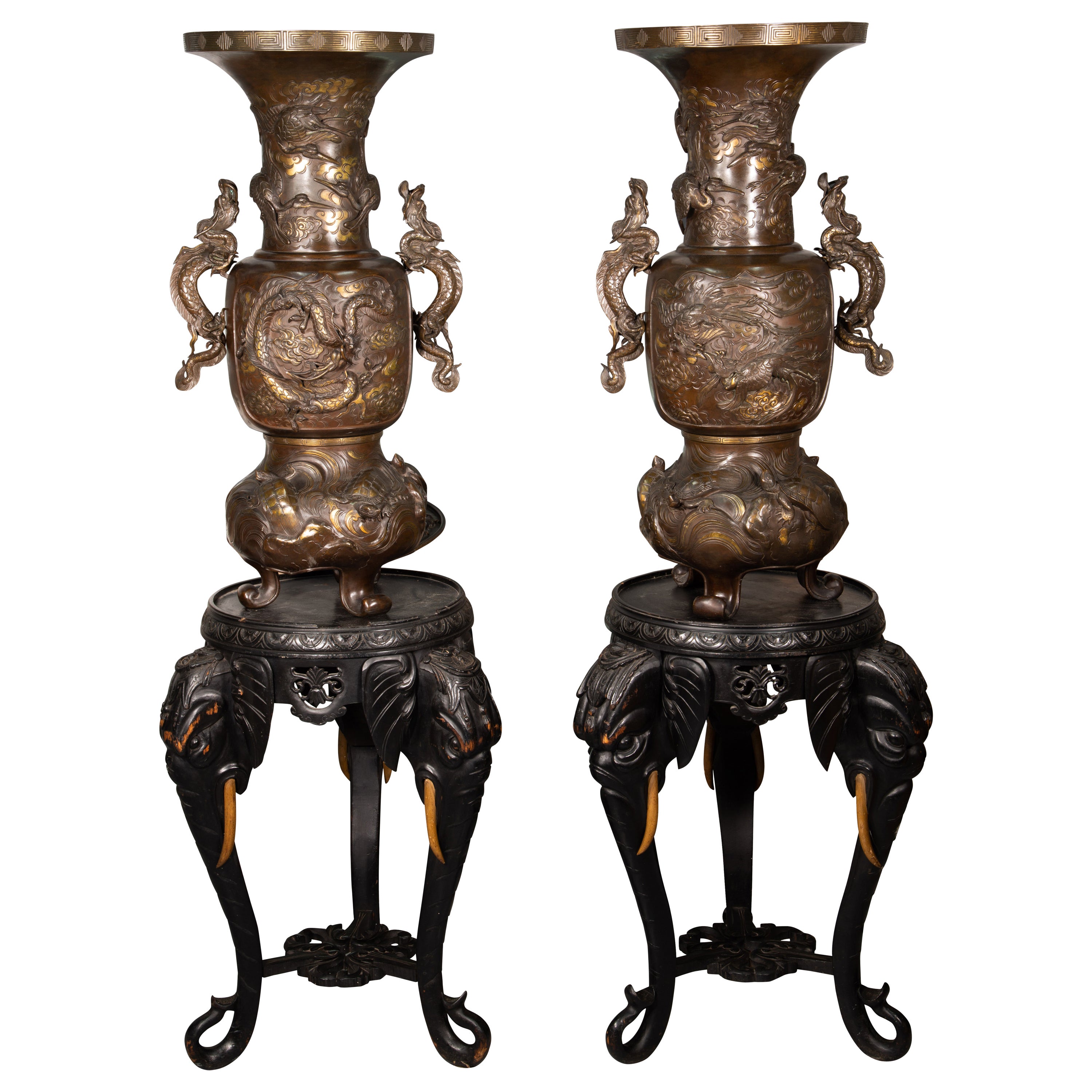 Pair of vases with bases with elephant heads. Bronze, wood, etc. 19th c. etc.