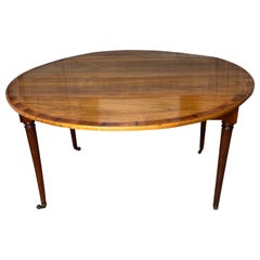 A 19th Century French Walnut Drop Leaf Dining Table