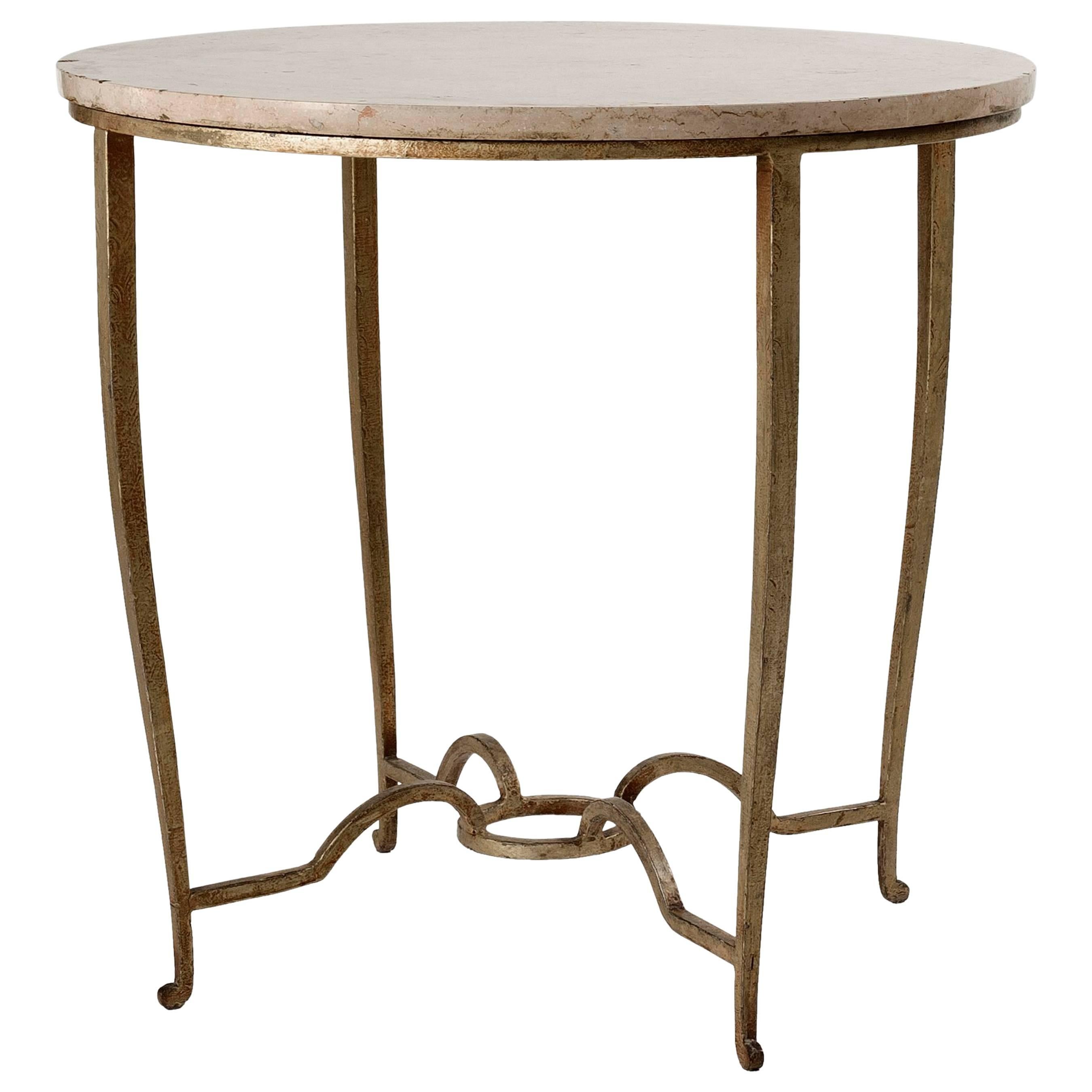 Maison Ramsay, Gilt wrought iron and travertine table, France, c. 1945