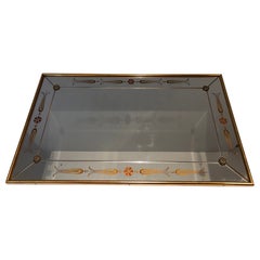 Important Mirror Engraved with Gold and Red Decorations. French work. Circa 1970