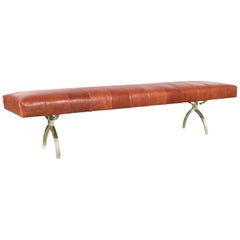 Banc vintage en cuir et laiton
