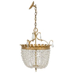 2 French Mid-Century chandeliers with a round brass top supporting multiple crys