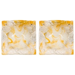 Pair of Contemporary textured amber glass sconces w/ half-round freeform design