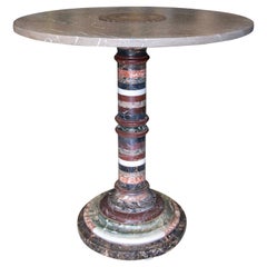 Mesa Gueridón con Piezas de Mármol de Distintos Colores y Bronce.