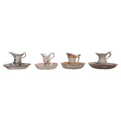 Four jugs with ceramic basins