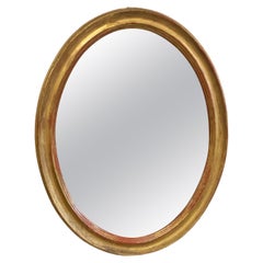 Specchio ovale da parete in legno dorato