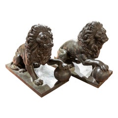 1980s Pair of Seated Bronze Lions with Ball in Paw