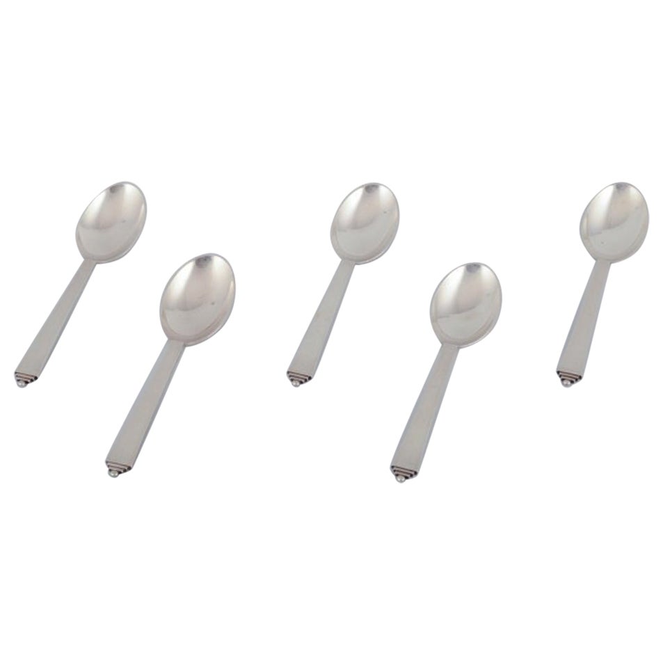 Georg Jensen Pyramid, five dessert spoons in sterling silver.