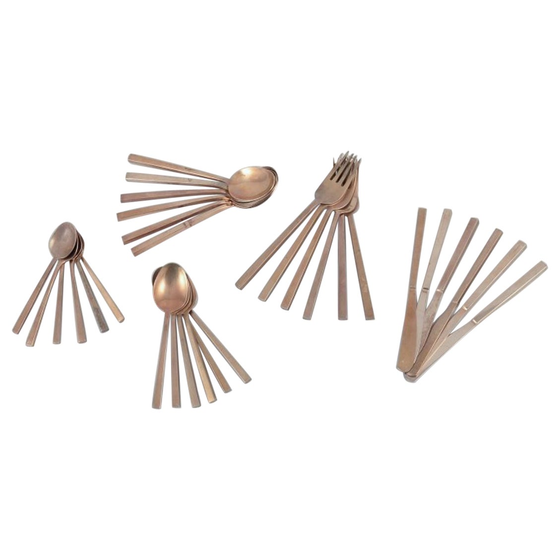 'Scanline' brass flatware by Sigvard Bernadotte. Six-person dinner set.
