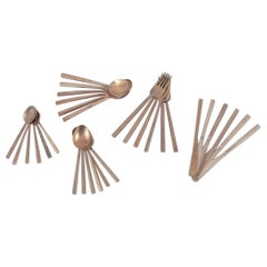 'Scanline' brass flatware by Sigvard Bernadotte. Six-person dinner set.