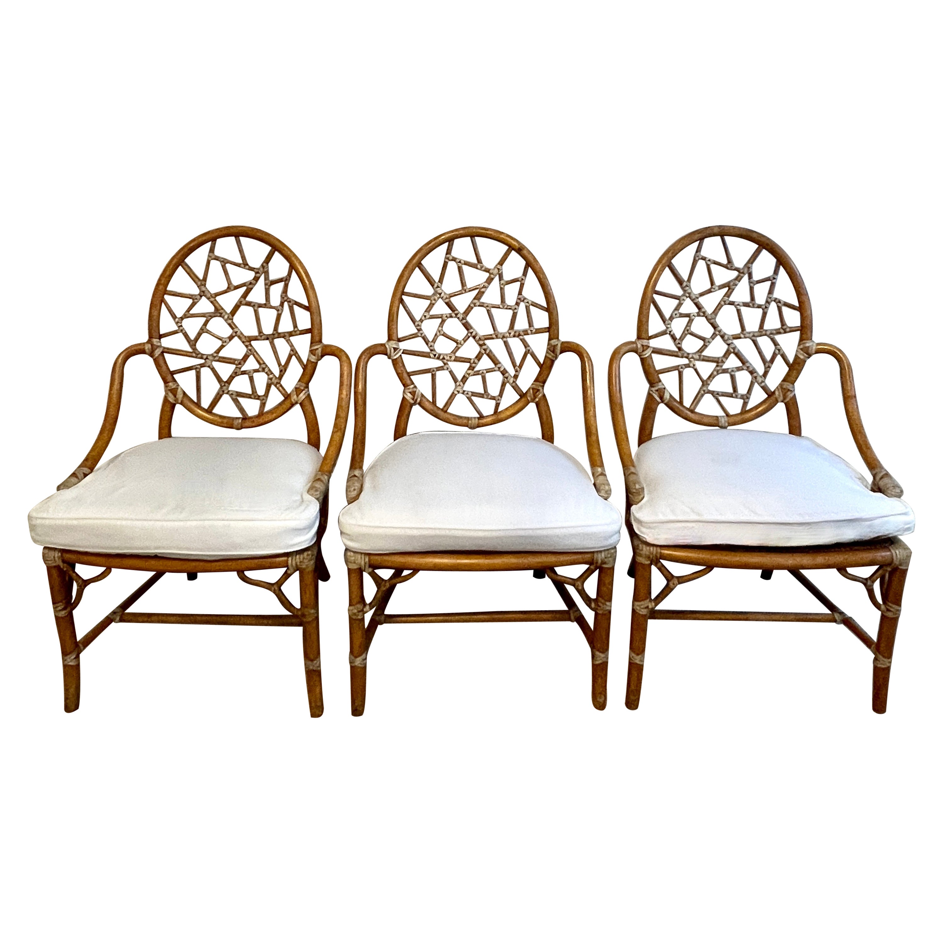 Iconic Cracked Ice Chair by McGuire.  The three are in exceptional condition and have beautiful, in tact, leather lashing.  We are only charging for two.. the third is a bonus.

A great trio for a breakfast room, garden room or covered patio.  Also