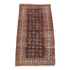 Antico tappeto Bahluli Baluch, disegno a reticolo con bordo avorio, Circa 1890
